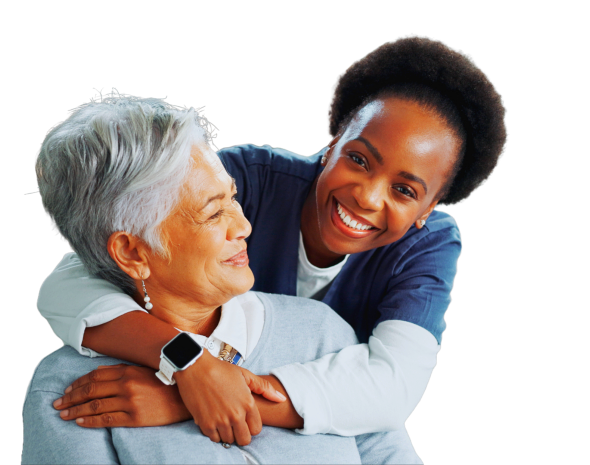 aide hugging the senior woman and smiling