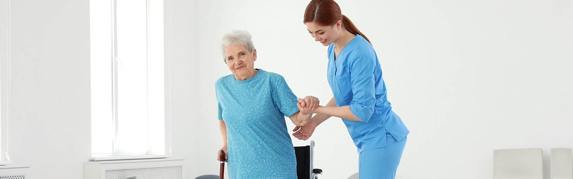 aide taking care of the senior woman